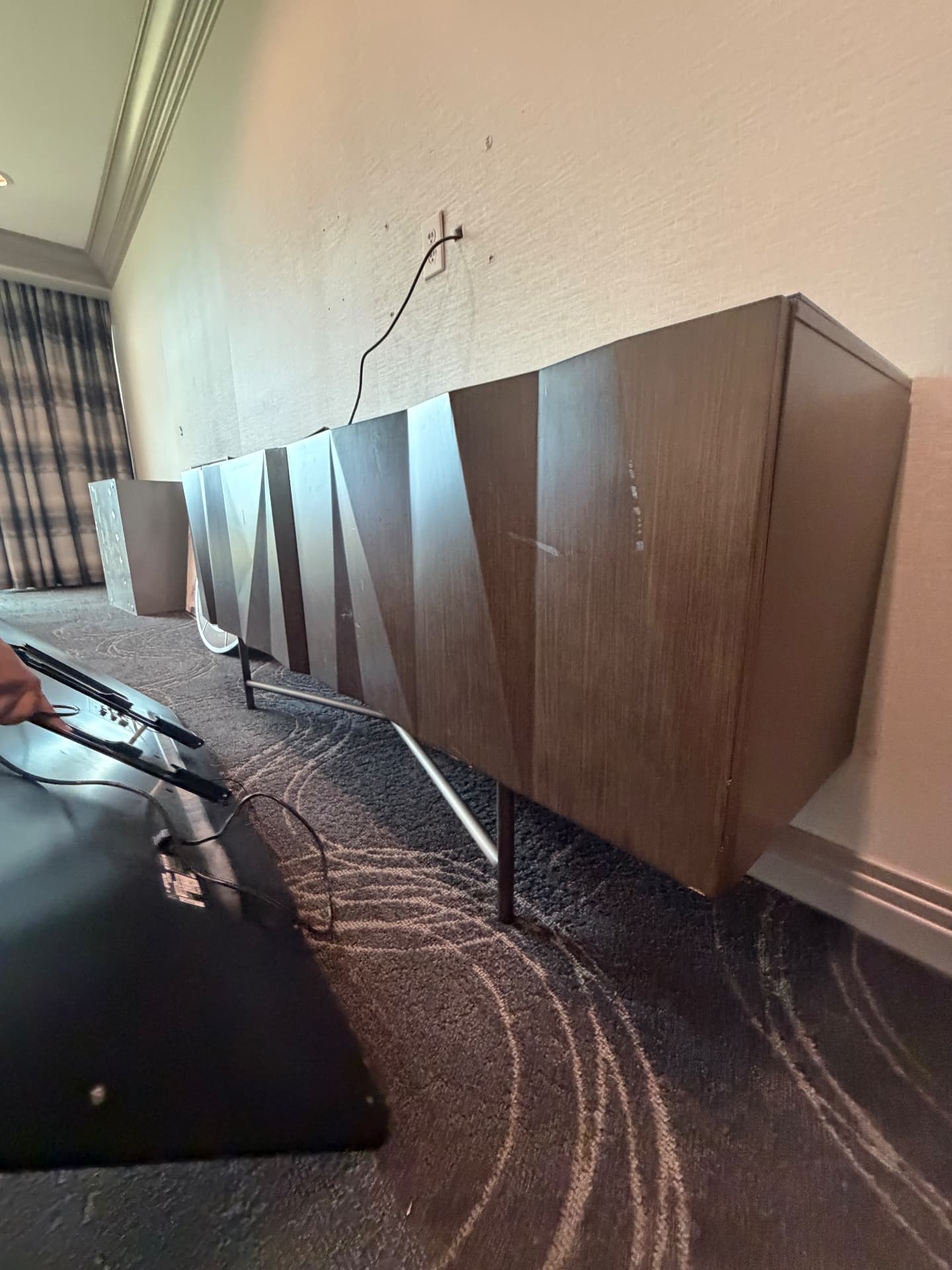 Suite credenza, headboard panels and TV wall mounts staged for pickup