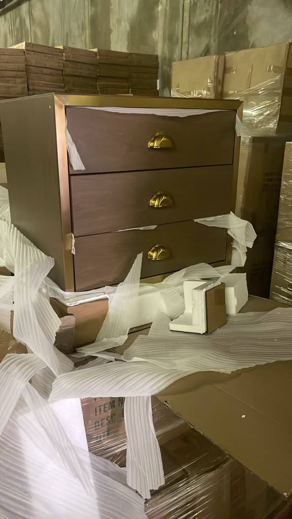 Brand-new three-drawer nightstand with brass hardware