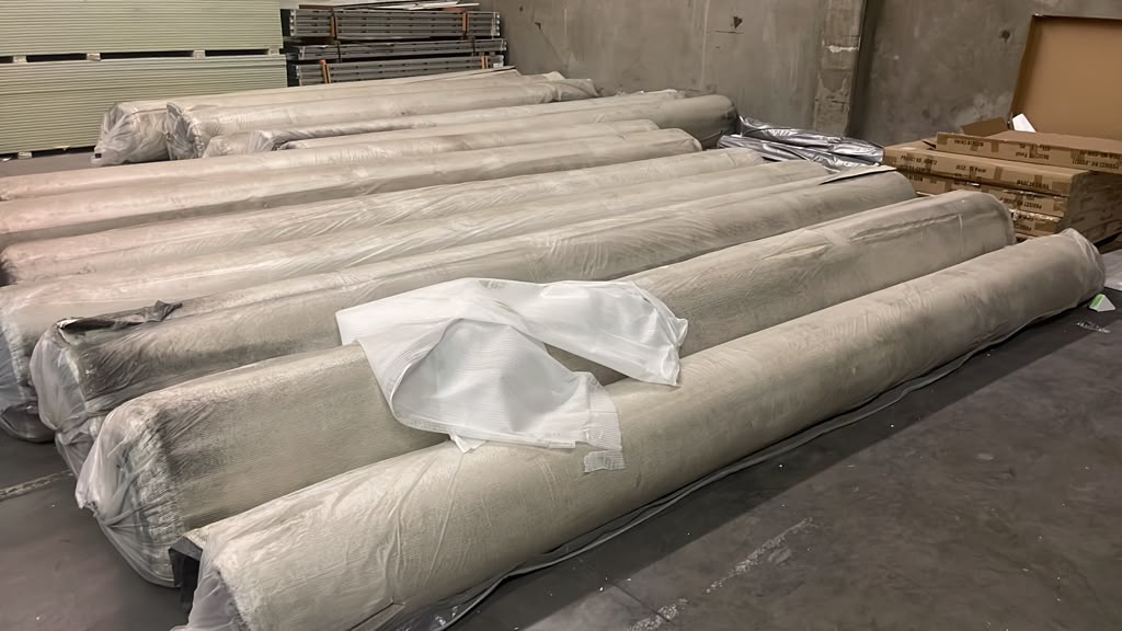 Additional rolls of new carpet wrapped and ready for pickup