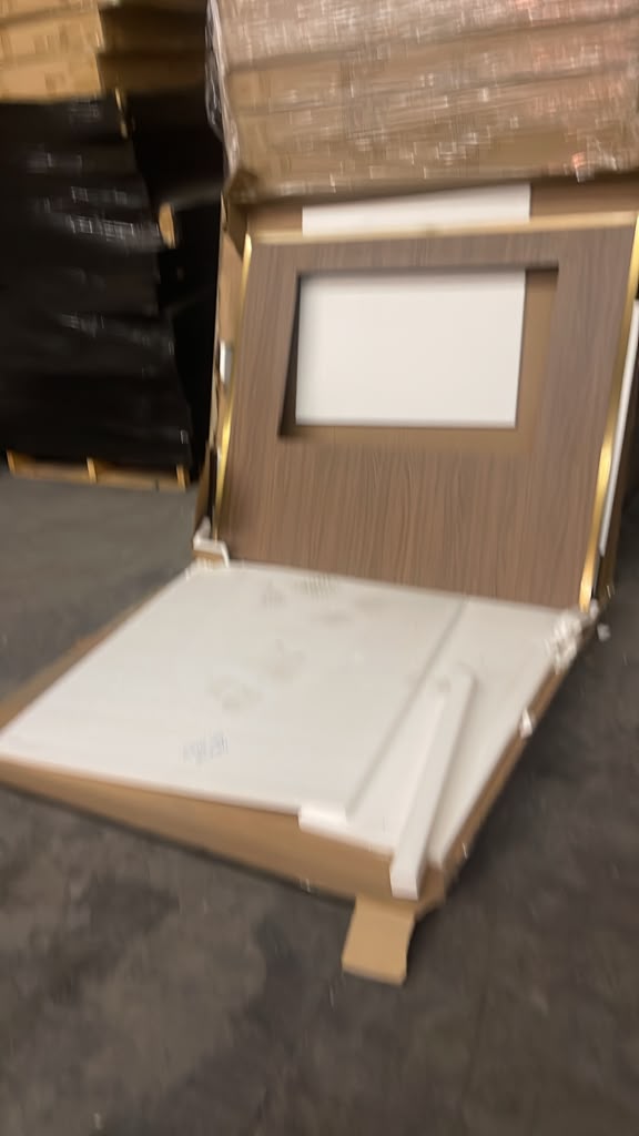 Brand-new guest room door and trim on a pallet