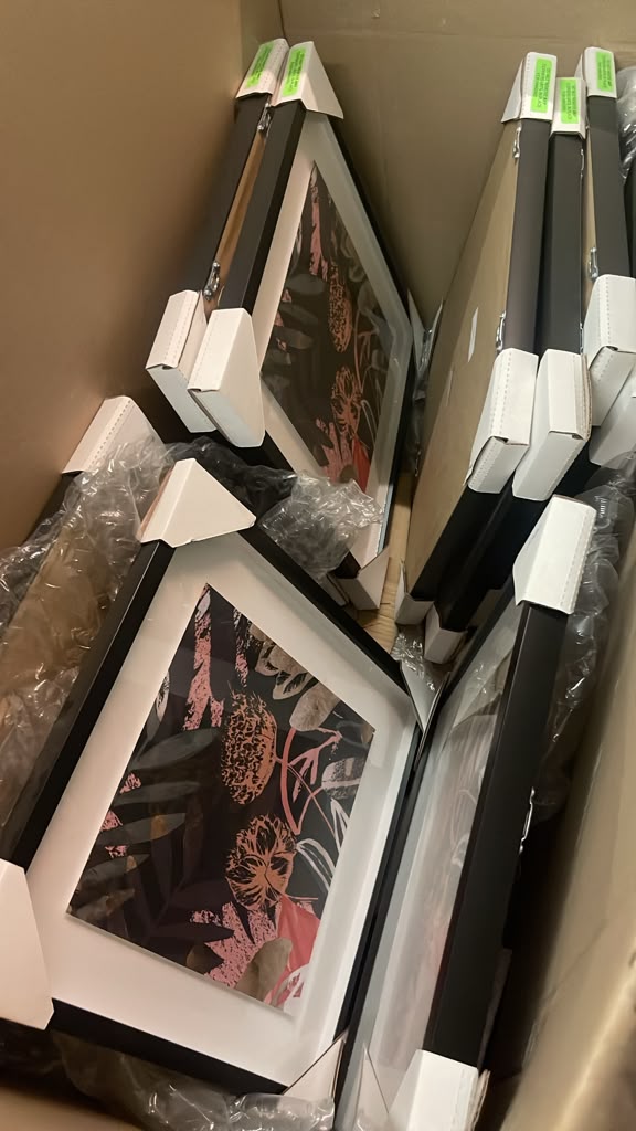 Boxed brand-new framed artwork for guest rooms