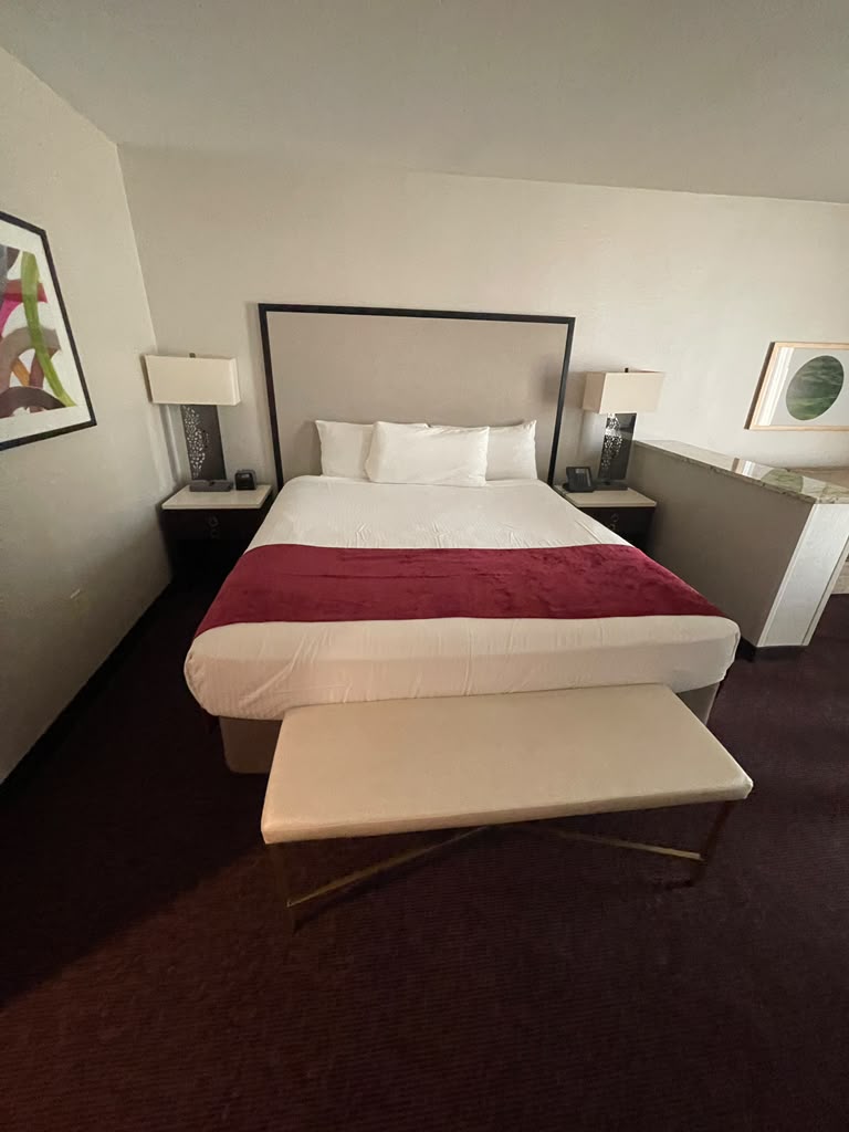 King room with matching nightstands, table lamps and framed artwork